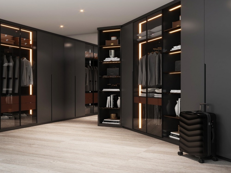 Vestidor minimalista de madera lacado en negro mate, diseño de lujo ligero, con tiras de luz integradas