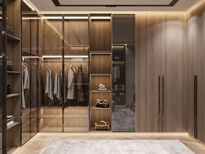 Vestidor minimalista moderno de madera maciza con acabado en melamina de nogal y puertas de vidrio con marco de aluminio